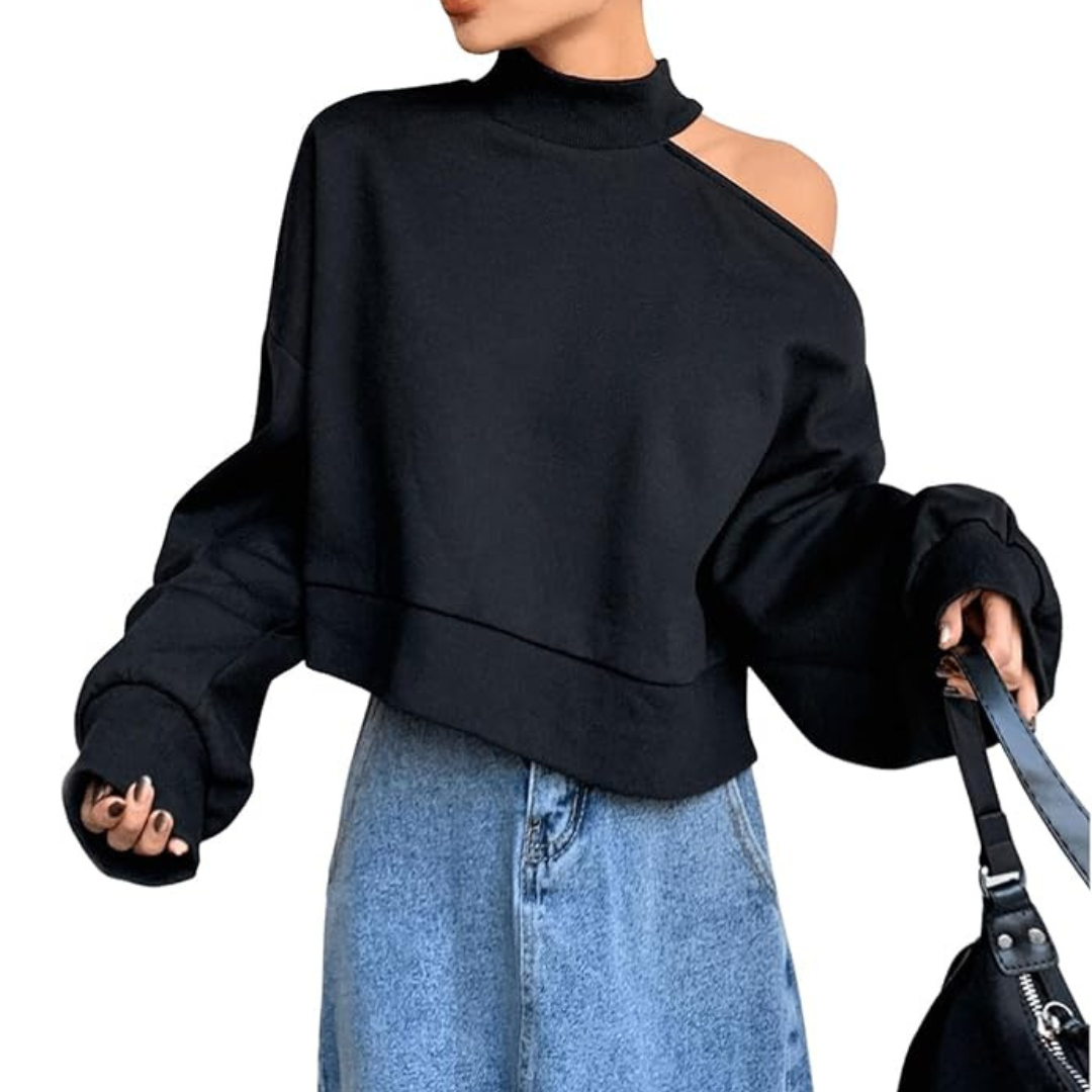 A woman wearing a black sweatshirt with a cut-out shoulder.