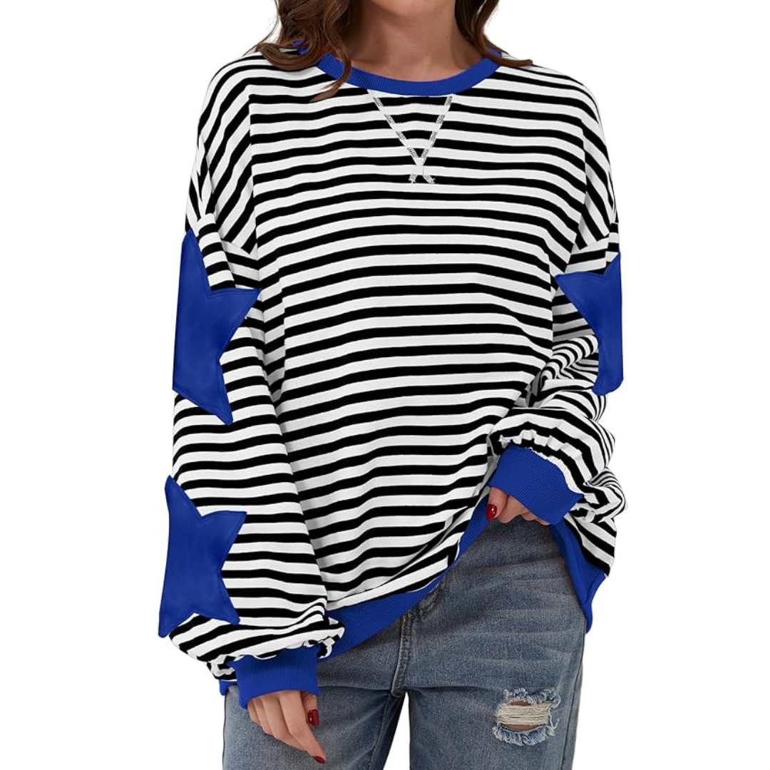 A woman wearing a striped sweatshirt with star appliques.